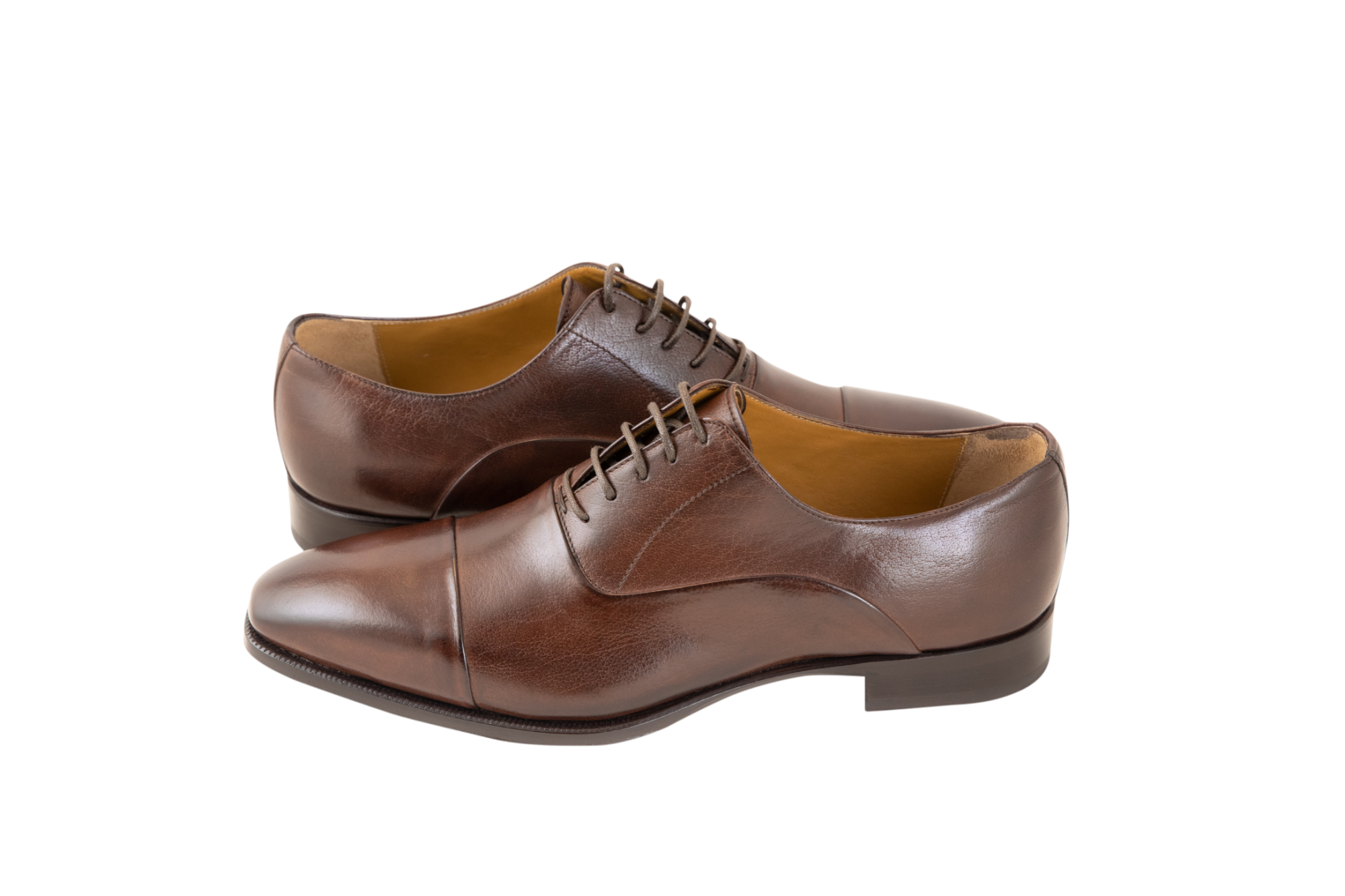 The classic men's leather Oxford shoe available in brown and black. Made from pure calf leather by our shoe artisans in Italy. Its sleek, elongated shape adds a modern touch to a classic design.