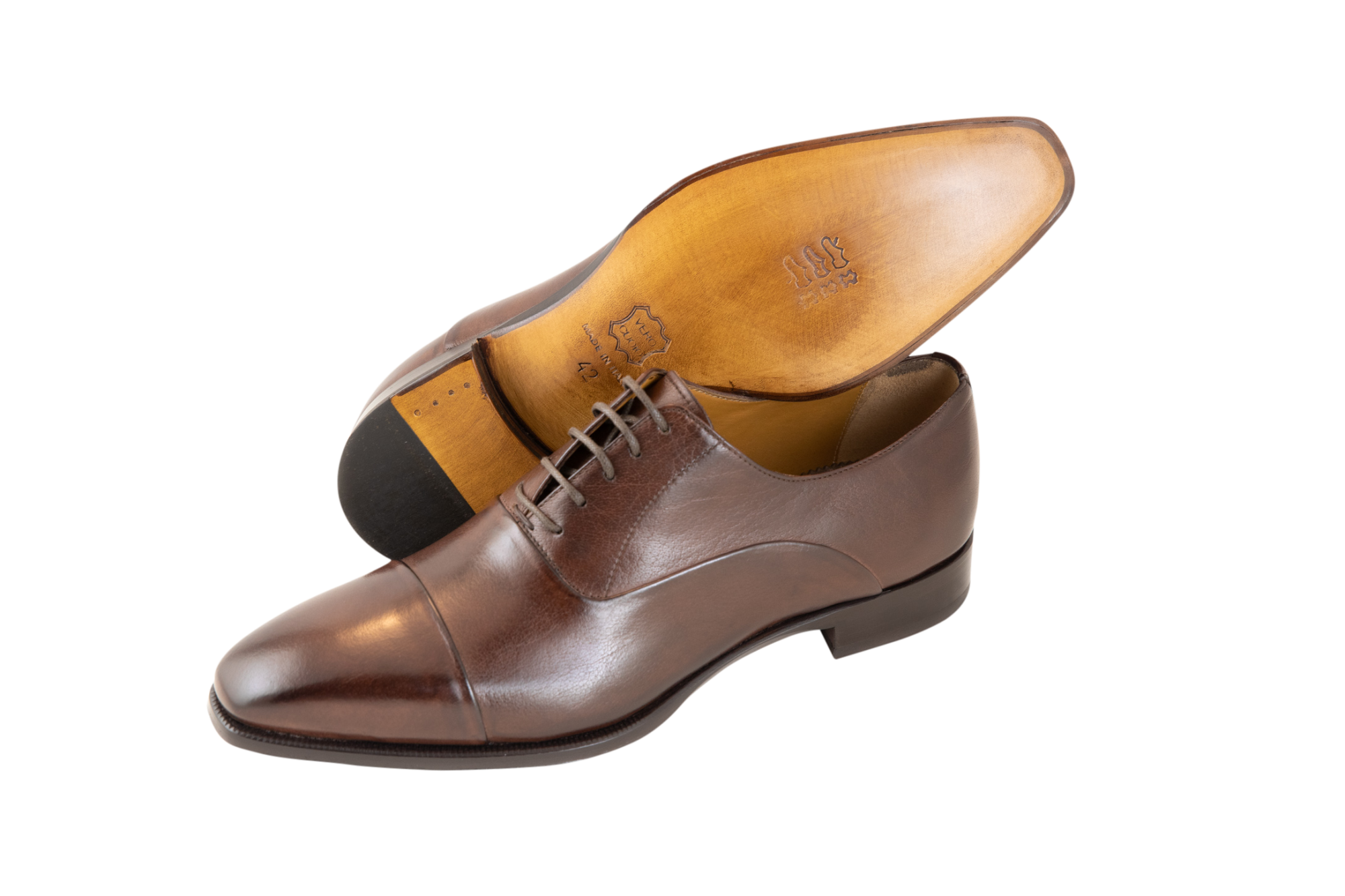 The classic men's leather Oxford shoe available in brown and black. Made from pure calf leather by our shoe artisans in Italy. Its sleek, elongated shape adds a modern touch to a classic design.