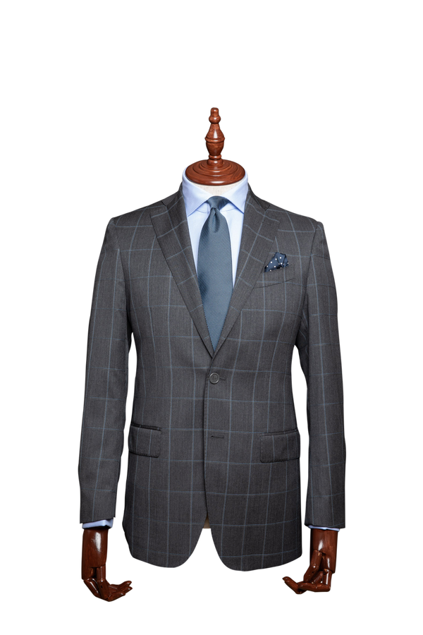 The Marechiaro men's suit is an elegant grey windowpane check with sky blue highlights. It has a lightweight construction, allowing you to wear it all year round.  