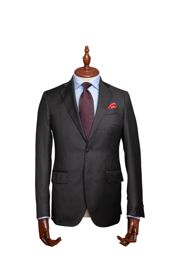 This English charcoal coloured men's suit, suitable for the corridors of power, be it Spring Street or Collins Street. Staple Loro Piana Four Seasons Super 130s wool fabric.