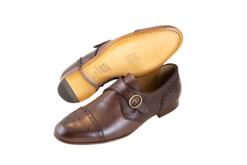 This single monk strap brogue is made in Italy from supple calf leather and available in brown. Features a leather sole, internal leather lining via a Blake stitched construction.