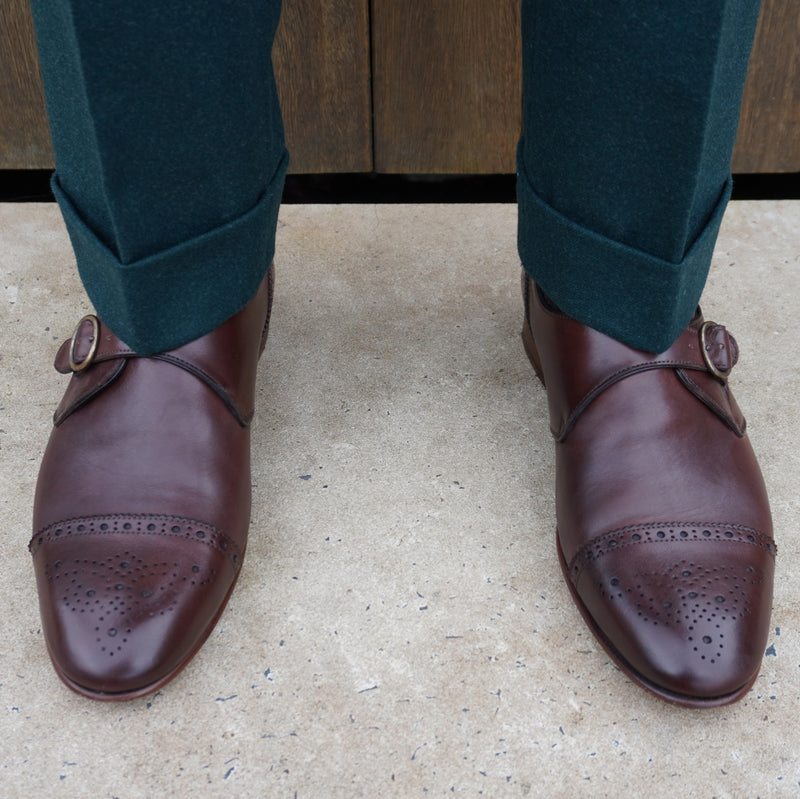 This single monk strap brogue is made in Italy from supple calf leather and available in brown. Features a leather sole, internal leather lining via a Blake stitched construction.
